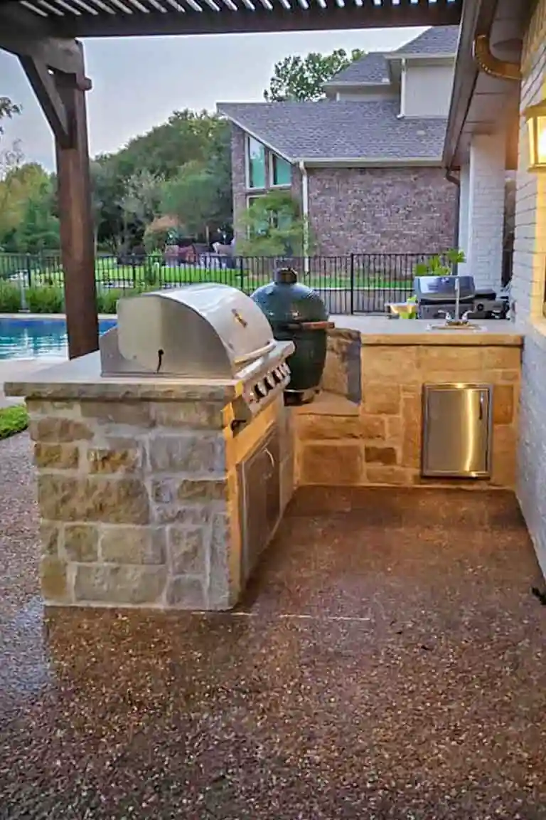 Stone outdoor kitchen with built in grill